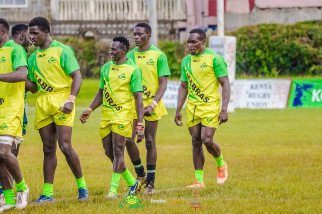 James Olela (second last) as Kabras exchange pleasantries with KCB © Fanaka Studios